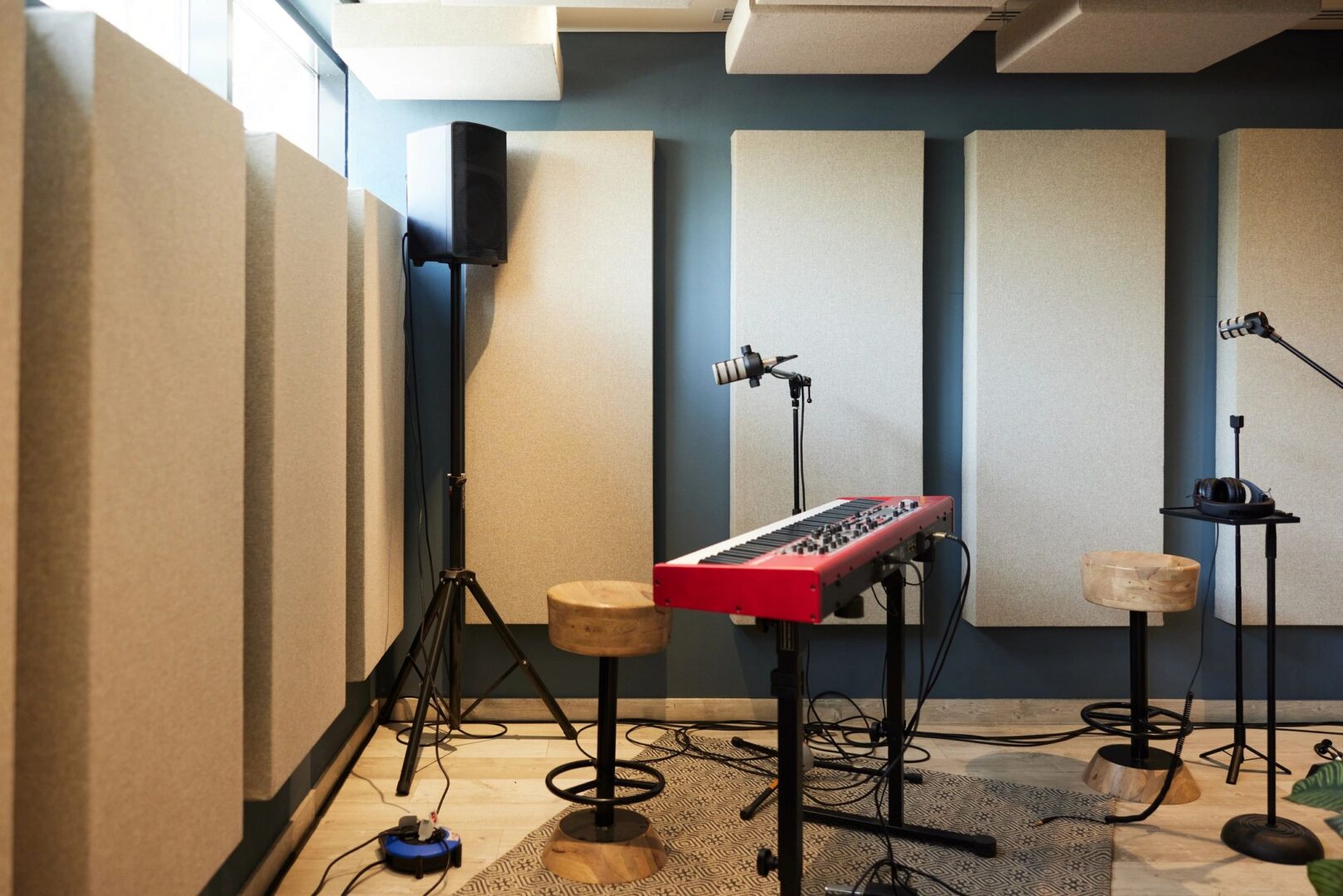 Recording studio with keyboard and microphones.