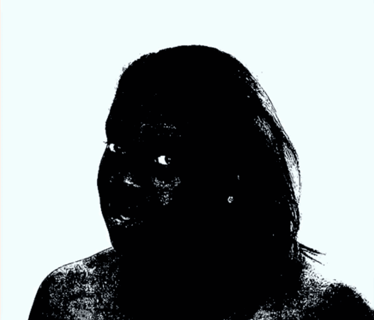 Silhouette of a person against a light background.